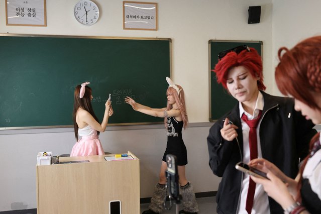 Visitors take photos dressed up as K-Pop idols in Shanghai, China, on April 5, 2025. (Photo by Go Nakamura/Reuters)