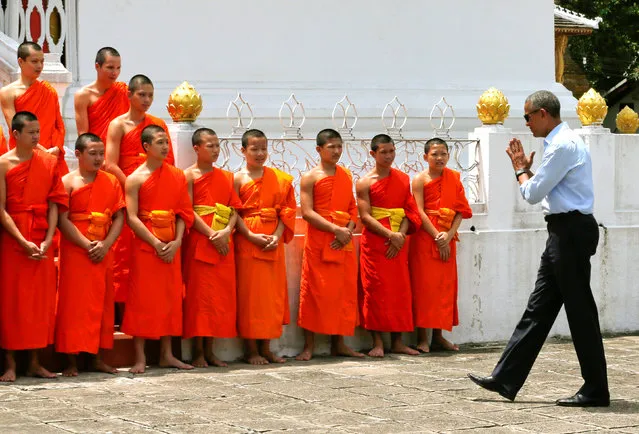 U.S. President Barack Obama greets novice monks at the Wat Xieng Thong Buddhist temple, alongside his participation in the ASEAN Summit, in Luang Prabang, Laos September 7, 2016. (Photo by Jonathan Ernst/Reuters)