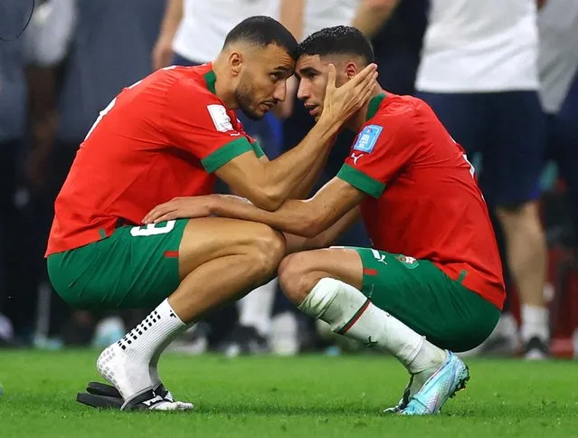 A dejected Romain Saiss and Achraf Hakimi of Morocco after losing 2-0 and being knocked out of the tournament during the FIFA World Cup Qatar 2022 semi final match between France and Morocco at Al Bayt Stadium on December 14, 2022 in Al Khor, Qatar. (Photo by Lee Smith/Reuters)