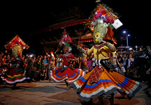 Masked dancers perform a traditional mask dance during the Indra Jatra festival in Kathmandu, Nepal September 13, 2016. (Photo by Navesh Chitrakar/Reuters)