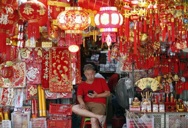 A vendor waits for customers next to traditional Chinese home decorations for sale in Chinatown, Bangkok, Thailand, 23 June 2025. The World Bank has revised down Thailand’s gross domestic product (GDP) growth forecast for 2025 to 1.8 percent, lowered from the earlier prediction of 2.9 percent, citing global uncertainties and higher US tariffs as significant headwinds slowing the economy. (Photo by Rungroj Yongrit/EPA)