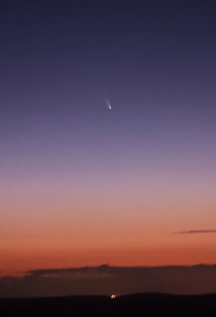 This image provided by NASA shoaws the comet PANSTARRS as seen from Mount Dale, Western Australia on March 5, 2013. According to NASA on March 10, it will make its closest approach to the sun about 28 million miles (45 million kilometers) away. As it continues its nightly trek across the sky, the comet may get lost in the sun's glare but should return and be visible to the naked eye by March 12. (Photo by AP Photo/NASA)