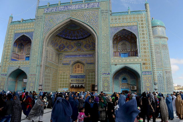 Afghan revellers are pictured at the Hazrat-e Ali shrine during Nowruz festivities in Mazar-i Sharif, the centre of the Afghan new year celebrations, on March 21, 2013. (Photo by Shah Marai/AFP Photo)