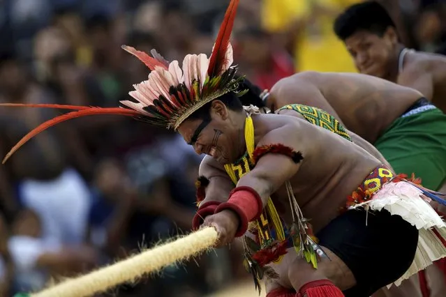 Indigenous people compete during a tug-of-war competition at the first World Games for Indigenous Peoples in Palmas, Brazil, October 25, 2015. (Photo by Ueslei Marcelino/Reuters)