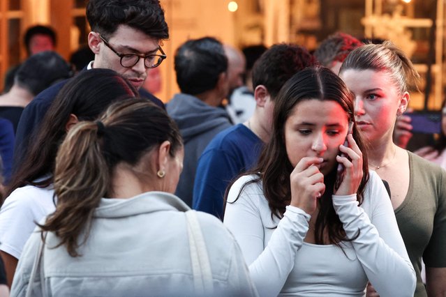 People react outside the Westfield Bondi Junction shopping mall after a stabbing incident in Sydney on April 13, 2024. Australian police on April 13 said they had received reports that “multiple people” were stabbed at a busy shopping centre in Sydney. (Photo by David Gray/AFP Photo)