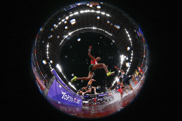Athletes compete in the men's 3000m steeplechase heats during the World Athletics Championships in Tokyo on September 13, 2025. (Photo by Kirill Kudryavtsev/AFP Photo)