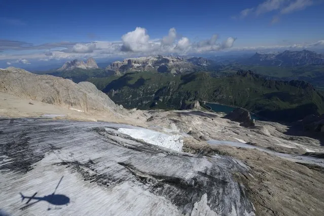 A view taken from a rescue helicopter of the Punta Rocca glacier near Canazei, in the Italian Alps in northern Italy, Tuesday, July 5, 2022, two day after a huge chunk of the glacier broke loose, sending an avalanche of ice, snow, and rocks onto hikers. (Photo by Luca Bruno/AP Photo)