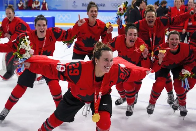 Canada's Marie-Philip Poulin (29) celebrates with her gold medal after the women's gold medal hockey game at the 2022 Winter Olympics, Thursday, February 17, 2022, in Beijing. (Photo by Matt Slocum/AP Photo)