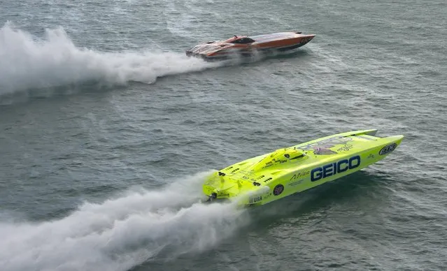 Marc Granet and Scott Begovich pilot "Miss Geico" past the start line in this handout photo provided by the Key West News Bureau during the first of three races at the Key West World Championship, November. 11, 2015, in Key West, Florida. (Photo by Andy Newman/Reuters/Florida Keys News Bureau)