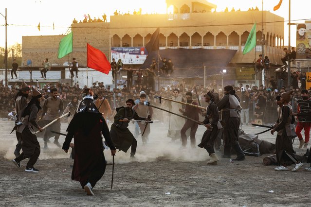 Shi'ite Muslim volunteers, dressed as ancient warriors, re-enact a scene from the 7th-century Battle of Karbala as part of a religious ritual to commemorate Ashura, the holiest day on the Shi'ite Muslim calendar, in Baghdad, Iraq, on July 6, 2025. (Photo by Ahmed Saad/Reuters)