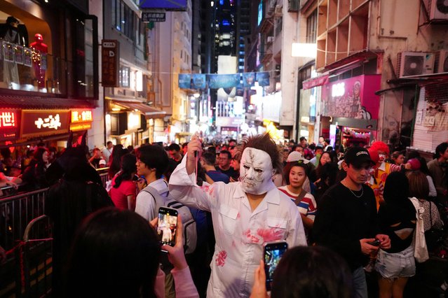 People wear costumes celebrating Halloween at Lan Kwai Fong, a popular nightlife destination in Central, in Hong Kong, China on October 31, 2025. (Photo by Lam Yik/Reuters)