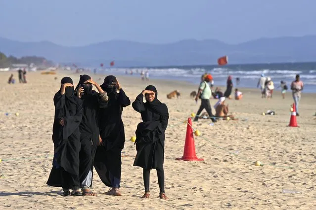 A group of Muslim girls takes a walk on a beach in Goa, India, Wednesday, May 3, 2023. India's picturesque state of Goa is scheduled to host the Shanghai Cooperation Organization (SCO) ministers meet on Friday, the latest avenue for the host nation to burnish its geopolitical credentials as it seeks to cement itself as a consequential global player. (Photo by Manish Swarup/AP Photo)