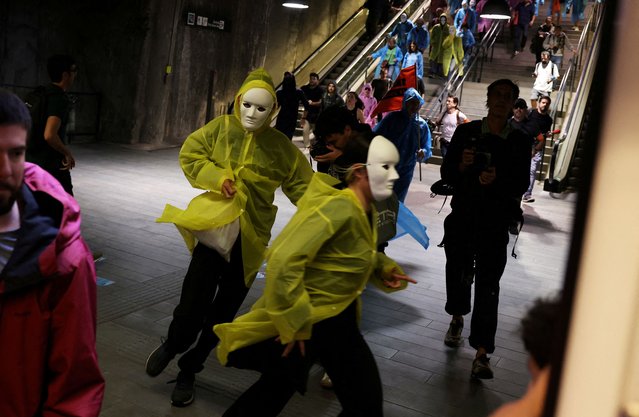 Demonstrators run inside of subway after clashing with riot police during a protest to denounce the housing crisis and evictions, in Barcelona, Spain, on September 25, 2024. (Photo by Nacho Doce/Reuters)