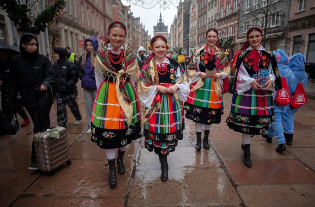 Young girls dressed in folk costumes pose for a photo during the 33rd Finale of the Great Orchestra of Christmas Charity in Gdańsk, Poland on January 27, 2025. The Great Orchestra of Christmas Charity is an annual fundraiser that targets sick children. The campaign covers the whole of Poland. In Gdańsk, almost 1,400 volunteers collected money on the streets of the city from the morning. Money was collected for paediatric oncology and haematology. The fundraising is accompanied by an online auction. The symbol of the orchestra is a red heart. (Photo by Agnieszka Pazdykiewicz/SOPA Images/Rex Features/Shutterstock)
