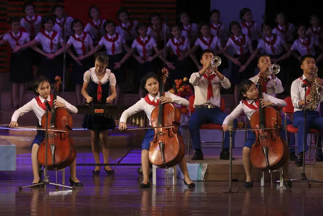 Students perform on stage during a presentation at Mangyongdae Children's Palace in Pyongyang, North Korea, Thursday, July 26, 2018. (Photo by Dita Alangkara/AP Photo)