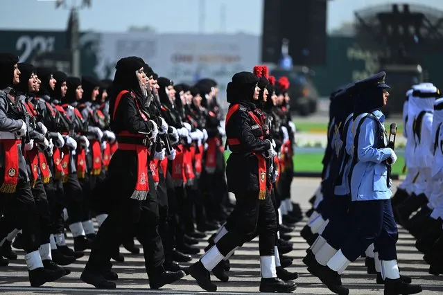 Soldiers march during the military parade to mark Pakistan's National Day in Islamabad on March 25, 2021. (Photo by Aamir Qureshi/AFP Photo)
