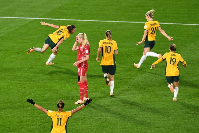 Amalie Vangsgaard of Denmark (centre) reacts as Hayley Raso of Australia (left) celebrates scoring a goal during the FIFA Women's World Cup 2023 Round of 16 soccer match between Australia and Denmark at Stadium Australia in Sydney, Monday, August 7, 2023. (Photo by Bianca De Marchi/AAP Image)