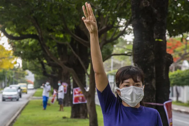 In this April 21, 2021, file photo, an anti-coup protester flashes the three-finger salute during a demonstration at Yangon, Myanmar. Leaders of the 10-member Association of Southeast Asian Nations meet Saturday, April 24, in Jakarta to consider plans to promote a peaceful resolution of the conflict that has wracked Myanmar since its military launched a deadly crackdown on opponents to its seizure of power in February. (Photo by AP Photo/Stringer)