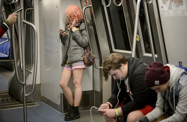 A girl rides on a train as she takes part in the No Pants Subway Ride in Bucharest, Romania, Sunday, January 10, 2016. (Photo by Andreea Alexandru/Mediafax via AP Photo)
