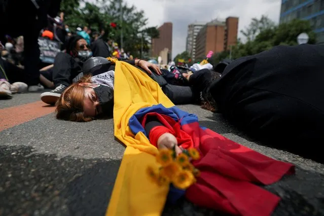 Demonstrators participate in a protest against poverty and police violence in Bogota, Colombia, May 5, 2021. (Photo by Nathalia Angarita/Reuters)