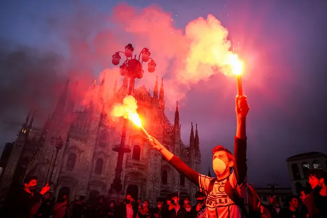 Inter fans celebrate the victory of the football championship in Piazza del Duomo square in Milan, Italy on May 2, 2021. (Photo by Nicola Marfisi/AGF/Rex Features/Shutterstock)
