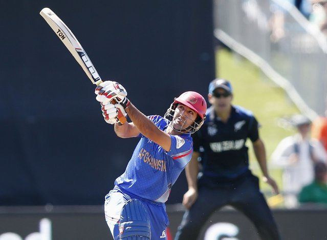 Afghanistan's Najib Zadran hits a six against New Zealand during their Cricket World Cup match in Napier, March 8, 2015. REUTERS/Nigel Marple (NEW ZEALAND - Tags: SPORT CRICKET)