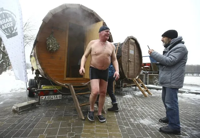 A man leaves a sauna during the Belarusian winter swimming championship in Minsk, Belarus December 18, 2016. (Photo by Vasily Fedosenko/Reuters)