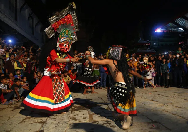 In this September 22, 2018, photo, mask dancers perform during Indra Jatra festival in Kathmandu, Nepal. (Photo by Niranjan Shrestha/AP Photo)