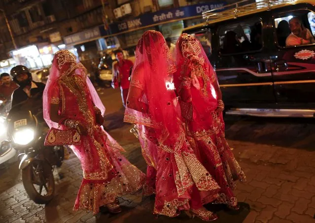Muslim brides cross a street as they leave for a mass marriage ceremony in Mumbai, India, January 27, 2016. (Photo by Danish Siddiqui/Reuters)