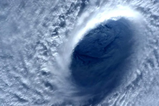 A picture made available on 02 April 2015 shows a close up of Super Typhoon Maysak's eye taken from the International Space Station (ISS), in space, 01 April 2015. The State weather bureau issued the alert for Typhoon Maysak as it enters towards the country ahead of Easter holidays. The public has been alerted against possible flashfloods over low-lying areas and landslides along mountain slopes. (Photo by Terry Virts/EPA/NASA)