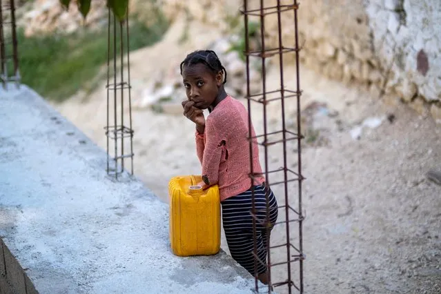 A girl looks on in Port-au-Prince, Haiti on July 17, 2021. (Photo by Ricardo Arduengo/Reuters)