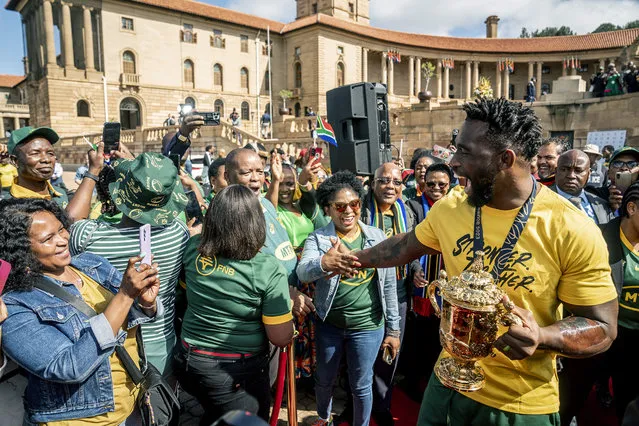 Springbok captain, Siya Kolisi greets fans as the team arrive at the Union Buildings for the start of their trophy tour after winning the 2023 Rugby World Cup, in Pretoria, South Africa, Thursday, November 2, 2023 . (Photo by Shiraaz Mohamed/AP Photo)