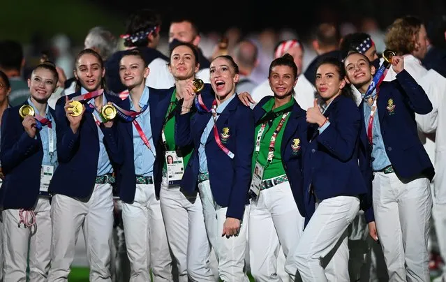 Bulgaria team members pose with their medals during the closing ceremony of the Tokyo 2020 Olympic Games, on August 8, 2021 at the Olympic Stadium in Tokyo. (Photo by Toby Melville/Reuters)