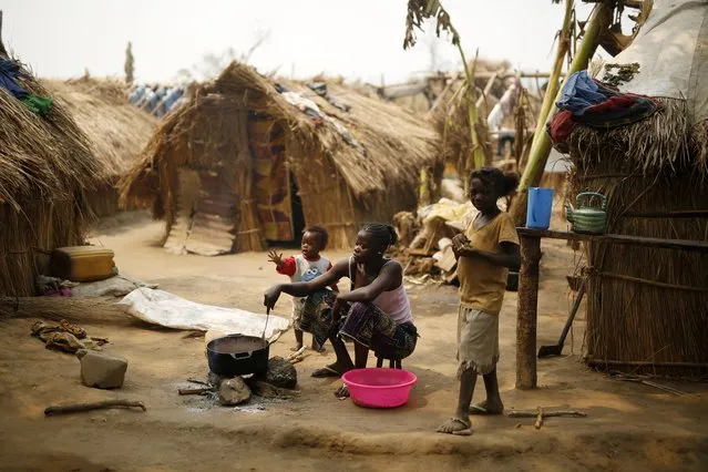 Christian families living in a refugee camp prepare food in Kaga-Bandoro, Central African Republic, Tuesday February 16,  2016. (Photo by Jerome Delay/AP Photo)