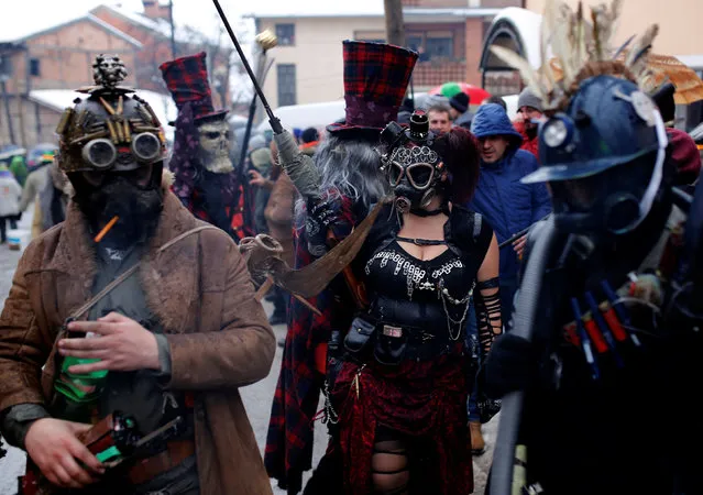 Revelers participate in a parade on the streets during a carnival to mark the annual Orthodox St. Vasilij Day in the village of Vevcani, south of the Macedonian capital of Skopje, January 13, 2017. (Photo by Ognen Teofilovski/Reuters)