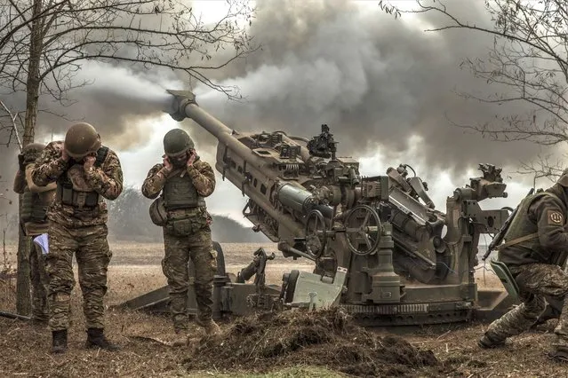A Ukrainian artillery unit fires an M777 howitzer at Russian armored vehicles near the town of Snihurivka in Ukraine’s southern Mykolaiv region on November 9,2022.Within a few hours, Ukrainian forces took control of the town, a major gateway to the key city of Kherson..(Photo by Heidi Levine for The Washington Post)
