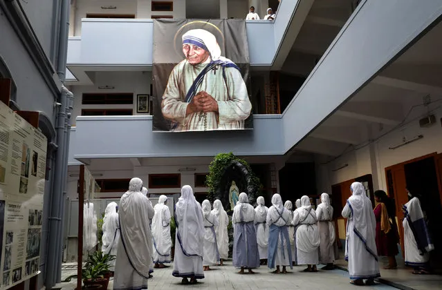 Nuns take part in a mass prayer at Mother House on Mother Teresa's 111th birth anniversary in Kolkata, India, 26 August 2021. Mother Teresa was born Agnes Gonxha Bojaxhiu on 26 August 1910 in Skopje, Macedonia. She began her missionary work with the poor in Kolkata in 1948, and won the Nobel Peace Prize in 1979. Mother Teresa was canonization as a saint by Pope Francis in 2016. (Photo by Piyal Adhikary/EPA/EFE)
