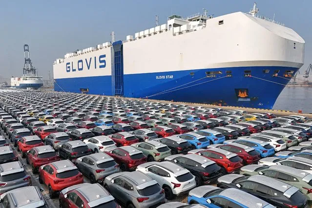 Cars wait to be loaded onto a ship for export at the port in Yantai, in China's eastern Shandong province on January 2, 2024. (Photo by AFP Photo/China Stringer Network)