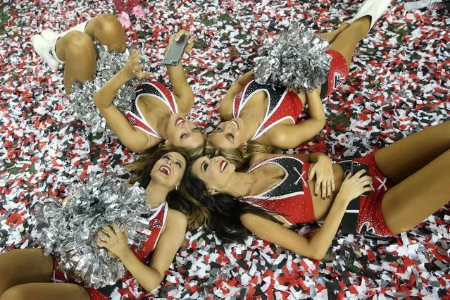 January 22, 2017; Atlanta, GA, USA; Atlanta Falcons cheerleaders take a picture in the confetti after the game against the Green Bay Packers in the 2017 NFC Championship Game at the Georgia Dome. Atlanta defeated Green Bay 44-21. (Photo by Jason Getz/USA TODAY Sports)