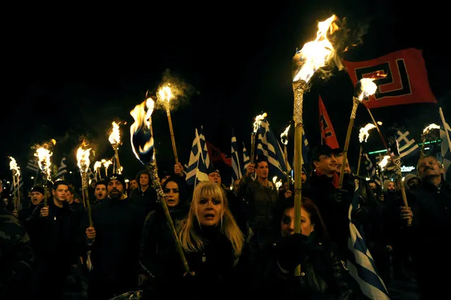 Supporters of Greece's far-right Golden Dawn party lift torches and wave national and party flags during an annual rally to commemorate the 21st anniversary of the Imia dispute, in Athens, Greece January 28, 2017. (Photo by Michalis Karagiannis/Reuters)