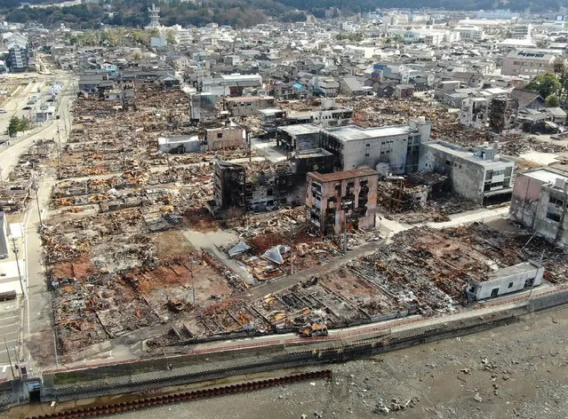 This aerial photo taken on January 29, 2024 by a drone shows a popular tourist area near Asaichi Dori in Wajima, Ishikawa prefecture which was destroyed by fire after a major 7.5 magnitude earthquake struck the Noto region in Ishikawa prefecture on January 1. (Photo by JIJI Press/AFP Photo)