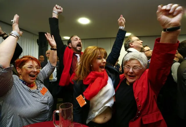Members of the Social Democrats (SPD) react to the first exit polls of the federal state of Rhineland-Palatinate election in the city of Mainz, Germany, March 13, 2016. (Photo by Ralph Orlowski/Reuters)