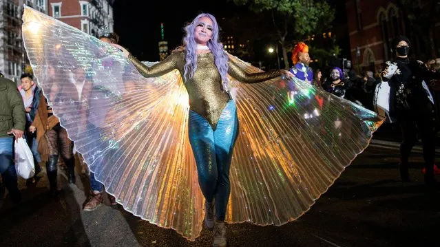 A woman takes part in the NYC Halloween Parade as the event returns to the streets of Lower Manhattan for the first time since the coronavirus disease (COVID-19) outbreak in New York City, New York, U.S., October 31, 2021. (Photo by Eduardo Munoz/Reuters)