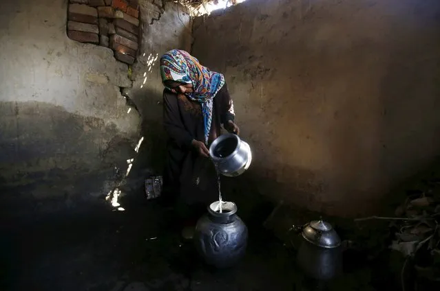 A Kashmiri woman fills a pot with water after collecting it from a river in Pattan, north of Srinagar, the summer capital of Indian Kashmir, 22 March 2016. World Water Day is observed on 22 March every year. World Water Day is an international observance and an opportunity to learn more about water related issues, be inspired to tell others and take action to make a difference. (Photo by Farooq Khan/EPA)