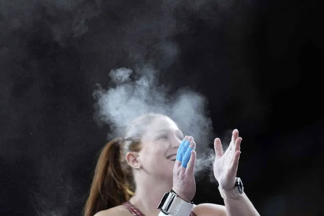 Sarah Mitton, of Canada, claps her hands while competing in the women's shot put during the World Athletics Indoor Championships at the Emirates Arena in Glasgow, Scotland, Friday, March 1, 2024. (Phoot by Bernat Armangue/AP Photo)