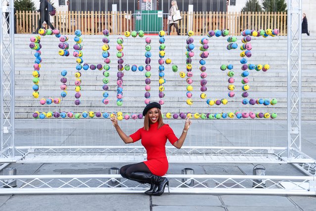 British singer Alexandra Burke has today, November 18, 2021 teamed up with The National Lottery to unveil a striking installation in Trafalgar Square to encourage the nation to think about how they might use some of the £30million raised for good causes each week in their own communities. The installation is made up of over 636 National Lottery balls to represent the 636,000 projects that have been supported over the last 27 years. (Photo by Tim P. Whitby/Getty Images for The National Lottery)