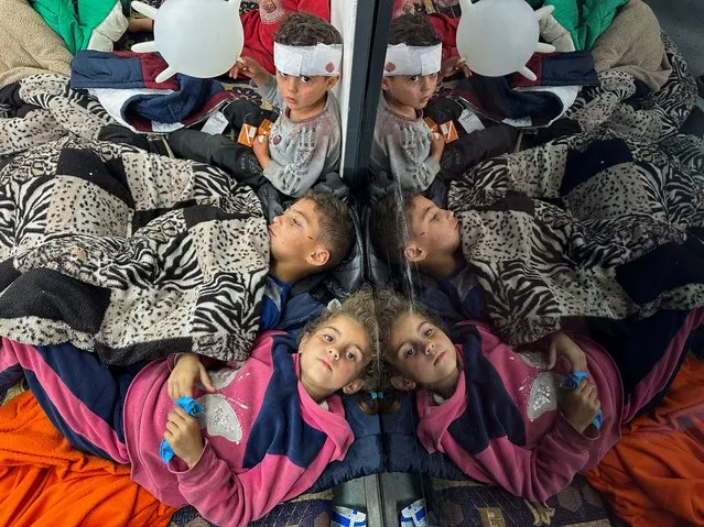 Palestinian children wounded in an Israeli strike rest as they receive treatment at a hospital, amid the ongoing conflict between Israel and the Palestinian Islamist group Hamas, in Rafah in the southern Gaza Strip on February 12, 2024. (Photo by Mohammed Salem/Reuters)