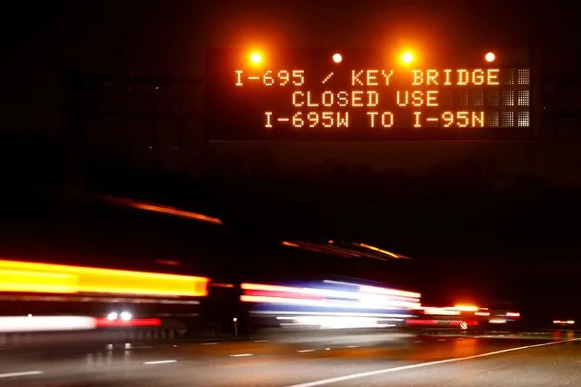 Highway signs direct drivers to a detour for Francis Scott Key Bridge following the bridge's collapse, in Baltimore, Maryland, U.S., March 26, 2024. (Photo by Julia Nikhinson/Reuters)