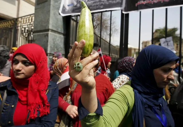 A woman gestures during a protest, to demand the government to offer unemployed graduates jobs, in front of the parliament headquarters in Cairo, March 27, 2016, where Egyptian Prime Minister Sherif Ismail was speaking. (Photo by Amr Abdallah Dalsh/Reuters)