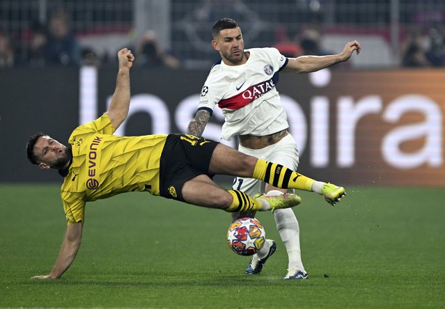 Dortmund's Niclas Fullkrug, left, and Lucas Hernandez of Paris battle for the ball during the Champions League semifinal first leg soccer match between Borussia Dortmund and Paris Saint-Germain at Signal Iduna Park, Dortmundm Germany, Wednesday May 1, 2024. (Photo by Federico Gambarini/dpa via AP Photo)